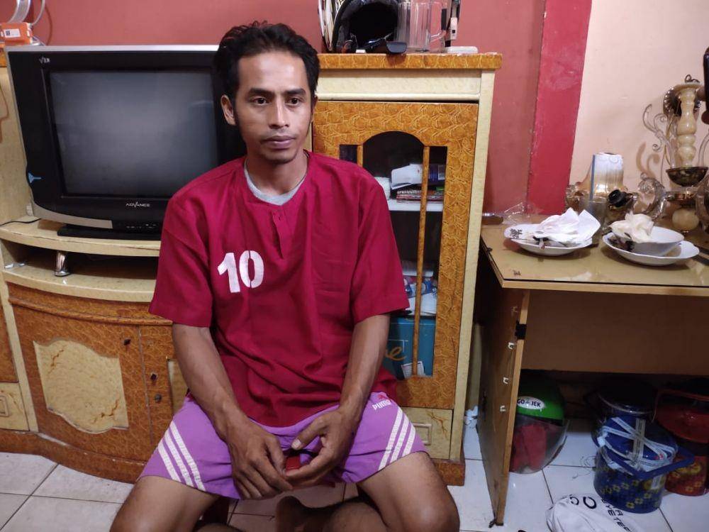 Tersangka AJI, diamankan di Polsek IB 1 Palembang (IDN Times/istimewa)