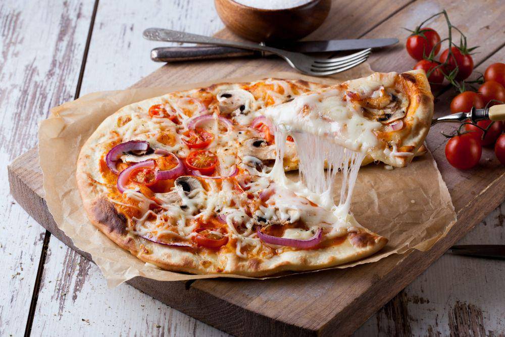 ilustrasi pizza (Unsplash/Kelvin T)