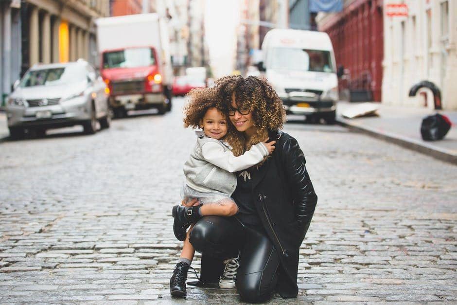 https://www.pexels.com/photo/ethnic-woman-with-child-sitting-on-sofa-with-netbook-5093639/