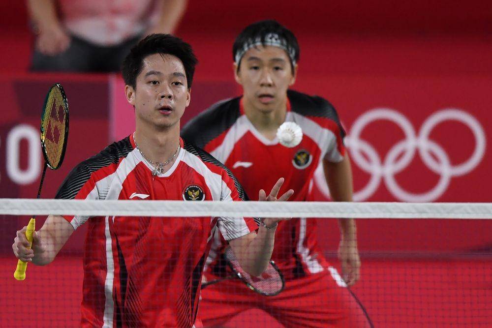 Ganda putra Indonesia Marcus Fernaldi Gideon dan Kevin Sanjaya Sukamuljo di Olimpiade Tokyo 2020. (ANTARA FOTO/Sigid Kurniawan)