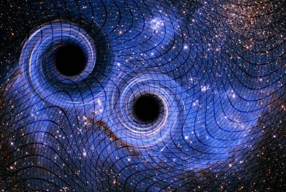 ilustrasi: pertemuan black hole ciptakan gelombang gravitasi dan riak di ruang waktu (ysjournal.com)