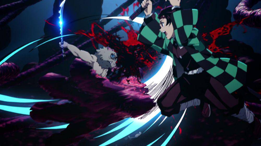Tanjiro dan Inosuke bertarung melawan Enmu. (dok. Studio Ufotable/Demon Slayer: Mugen Train)