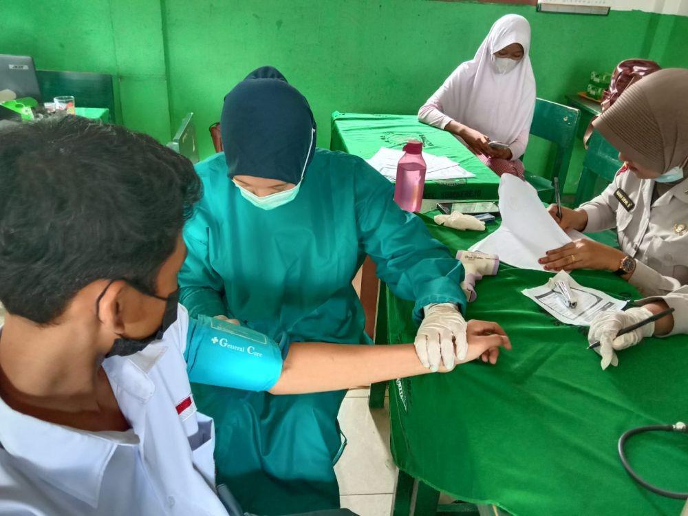 Polres Tanggamus kembali melaksanakan vaksinasi keliling di wilayah Kecamatan Sumberejo. (IDN Times/Istimewa).