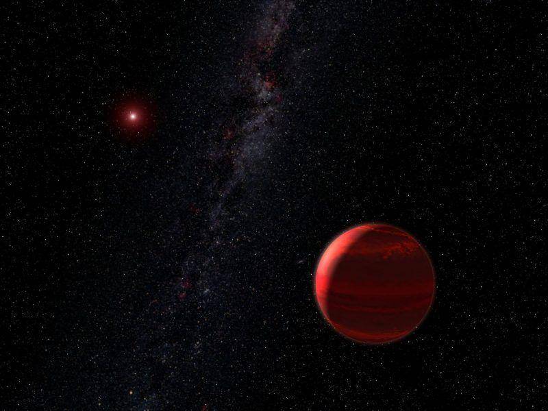 ilustrasi dari bintang merah dengan sebuah planet yang mirip dengan Barnard's Star (earthsky.org)