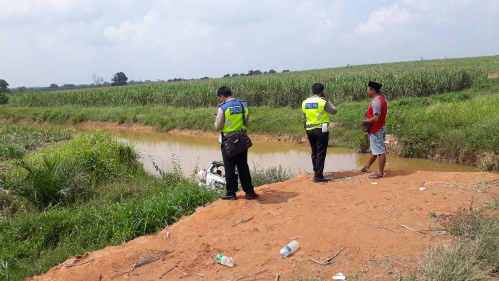 Lokasi kecelakaan di Jalan Lintas Rawa Jitu, PT Bangun Nusa Indah Lampung (BNIL), Kecamatan Banjar Margo, Kabupaten Tulang Bawang, Minggu (24/10/2021). (Dot Satlantas Polres Tulang Bawang).