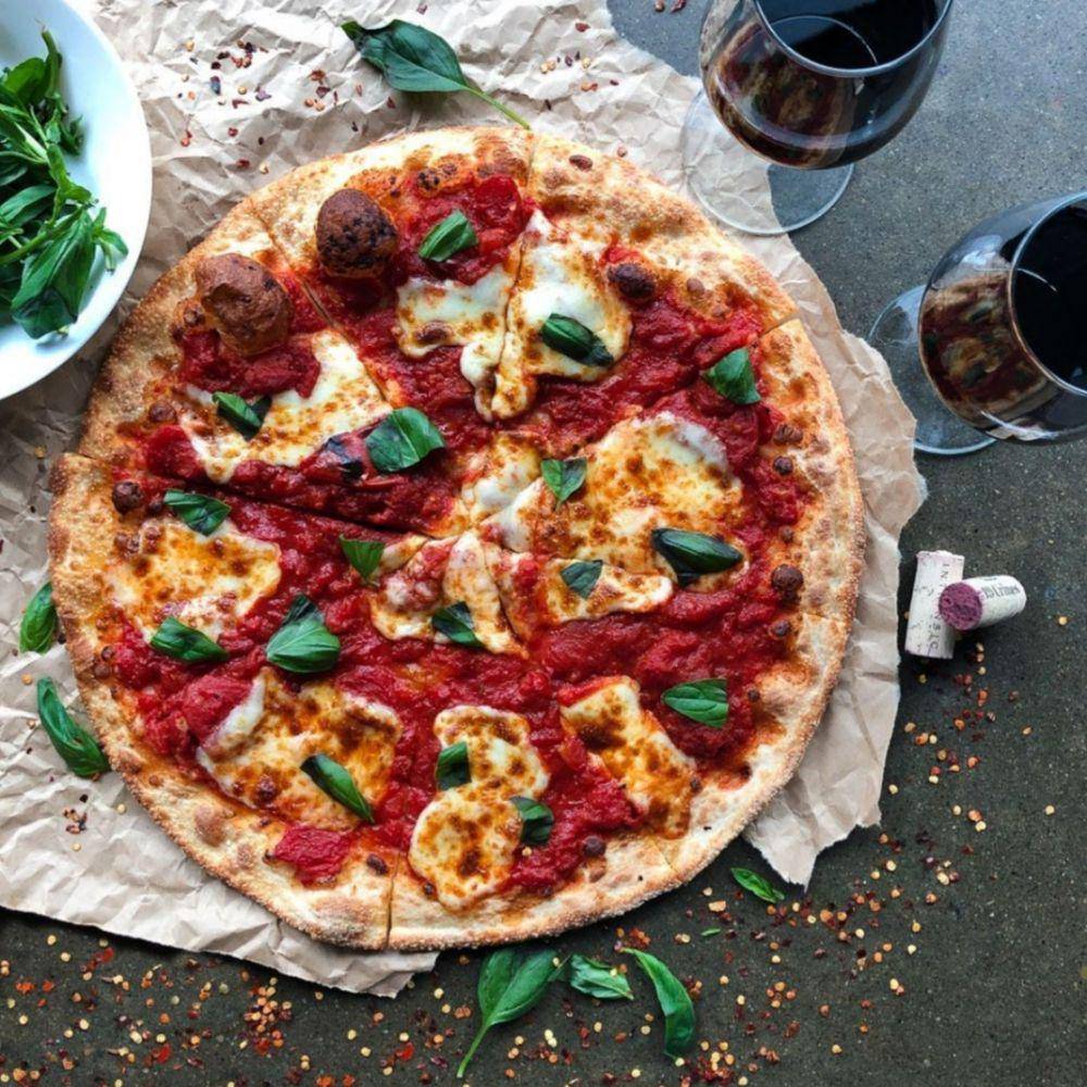 New York-style pizza (instagram.com/twocitiespizza)