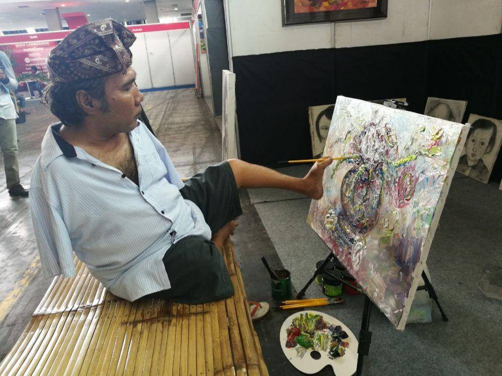 Sadikin Pard, salah satu seniman difabel The Able Art (Dok. Tokopedia)