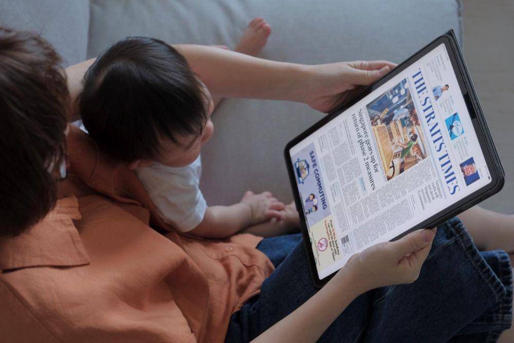 Pembaca The Straits Times dok. The Straits Times