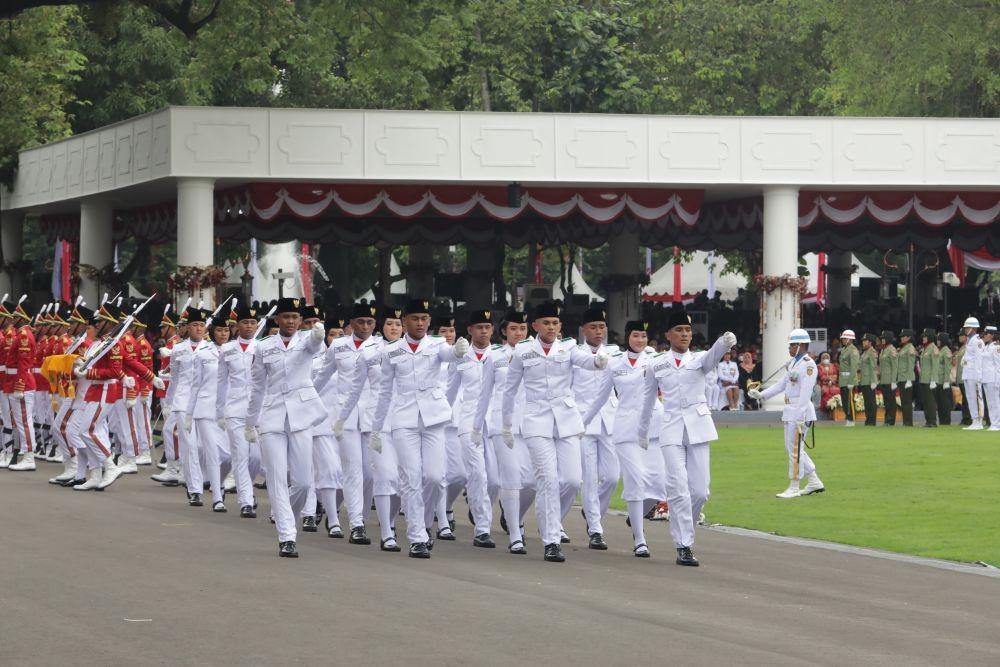 Pasukan Pengibar Bendera Pusaka (Paskibraka) saat bertugas pada peringatan HUT Ke-77 RI di Istana Merdeka. (Dok. Telkom)