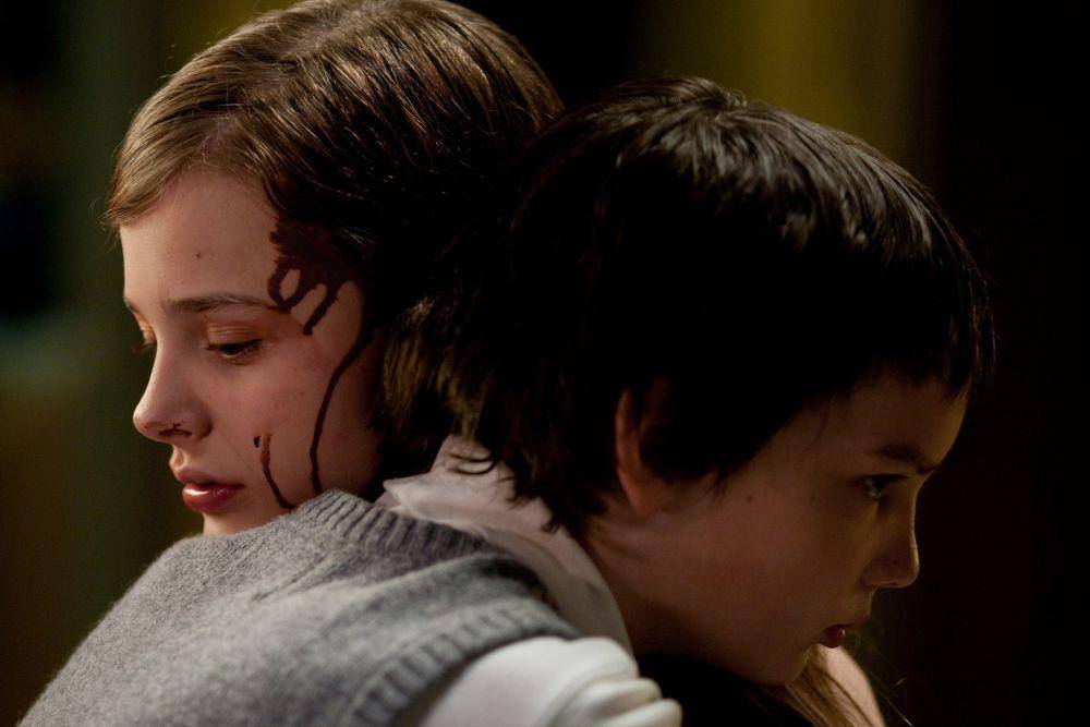 Kodi Smit-McPhee dan Chloë Grace Moretz dalam film Let Me In (dok. Hammer Films/Let Me In)