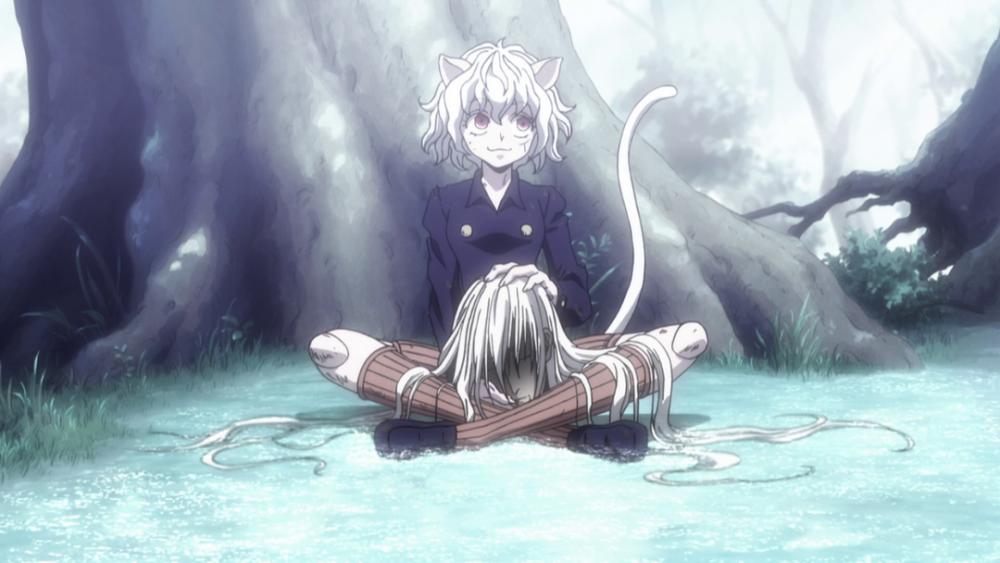 Pitou memegang kepala Kite. (dok. MADHOUSE/Hunter x Hunter)