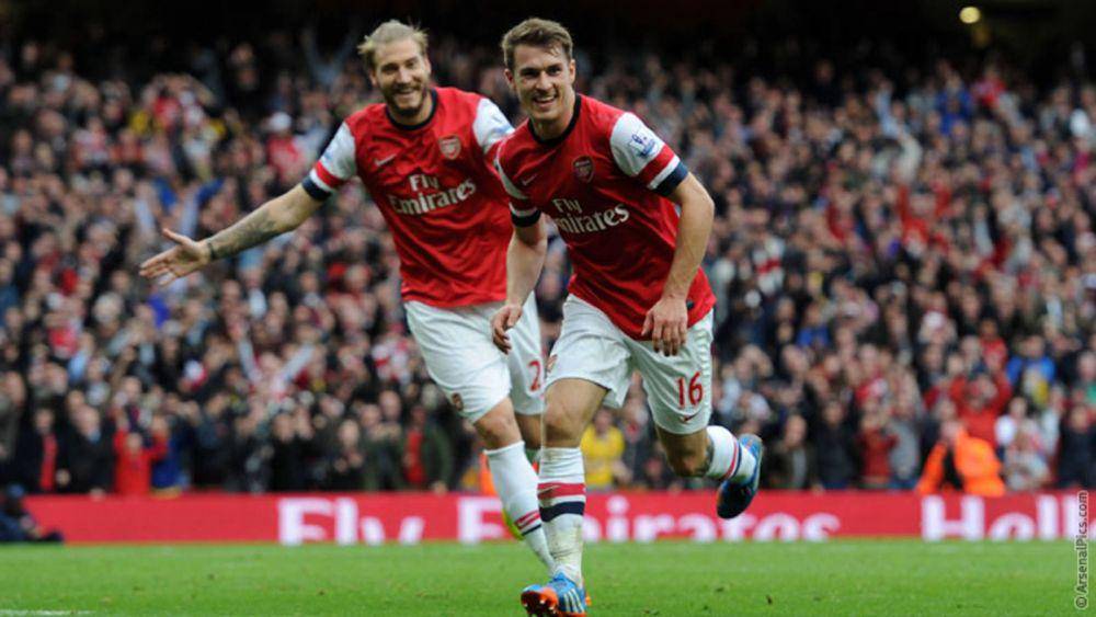 Aaron Ramsey ketika membela Arsenal pada musim 2013/2014. (arsenal.com)