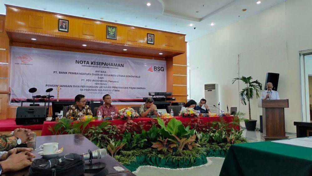 PT Pos Indonesia (Persero) menjalin kerja sama dengan PT Bank Pembangunan Daerah Sulawesi Utara dan Gorontalo (BSG) di Kantor Pusat Bank SulutGo, Manado, Sulawesi Utara, pada Jumat (20/1/2023). (Dok. Pos Indonesia)