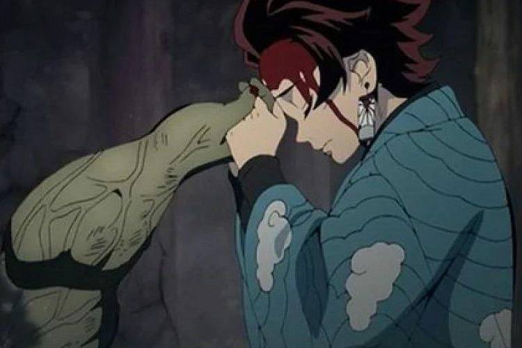 Tanjiro Kamado mendoakan Hand Demon (dok. ufotable/Kimetsu no Yaiba)