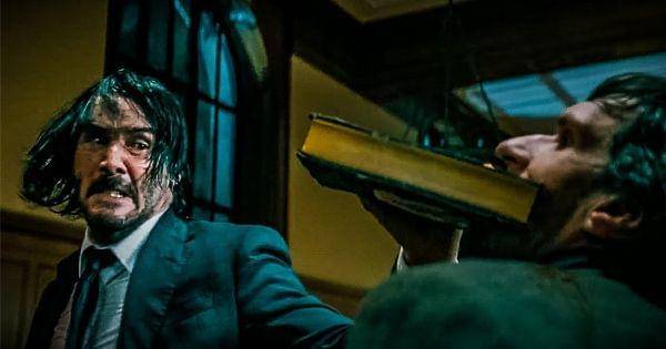 John mematahkan rahang Ernest dengan buku ( Dok. Lionsgate / John Wick 3 )