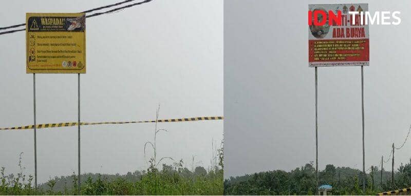 Plang himbauan waspada buaya yang dipasang disekitar waduk di PT. Argo Indomas (IDN Times/Ervan)