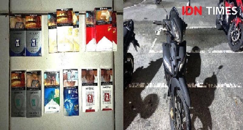 Barang bukti rokok dan sepeda motor yang diamankan dari tangan tersangka JKG (IDN Times/Ervan)