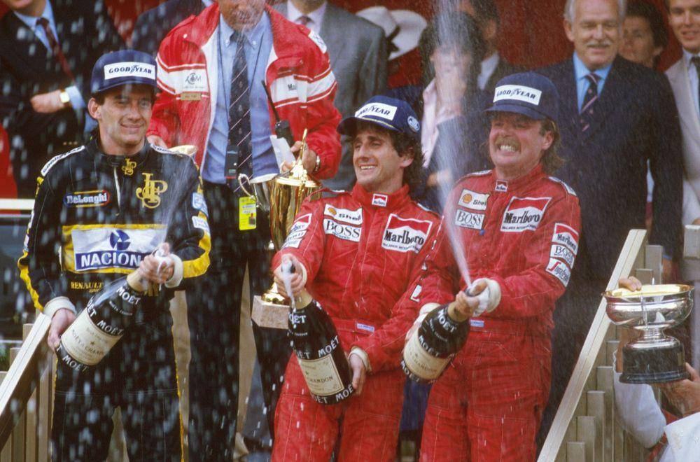 Alain Prost dan Keke Rosberg membawa McLaren menang 1-2 di GP Monako 1986 dengan Ayrton Senna dari Lotus berada di podium ketiga. (twitter.com/McLaren)
