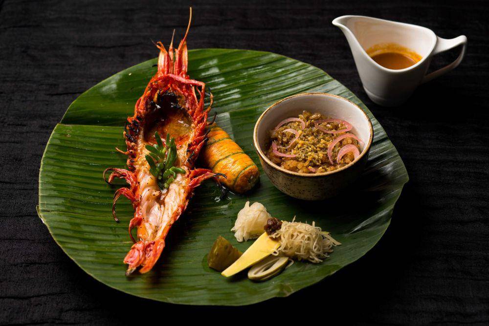 Hidangan Fiesta! Kamayan Feast hasil kolaborasi antara chef Johanne dan chef Jordy dalam festival kuliner MARQUEE Experiental Dining pada 24 Mei 2023. (Dok. Marina Bay Sands)