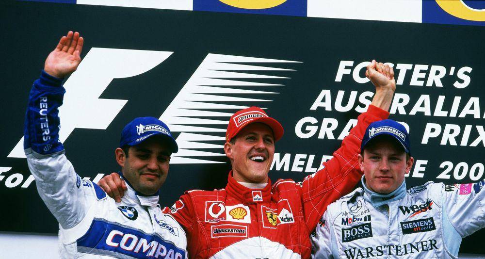 Michael Schumacher (tengah) menjuarai GP Australia 2002 dengan Juan Pablo Montoya (kiri) di podium kedua dan Kimi Raikkonen (kanan) di podium ketiga. (twitter.com/Formula 1)