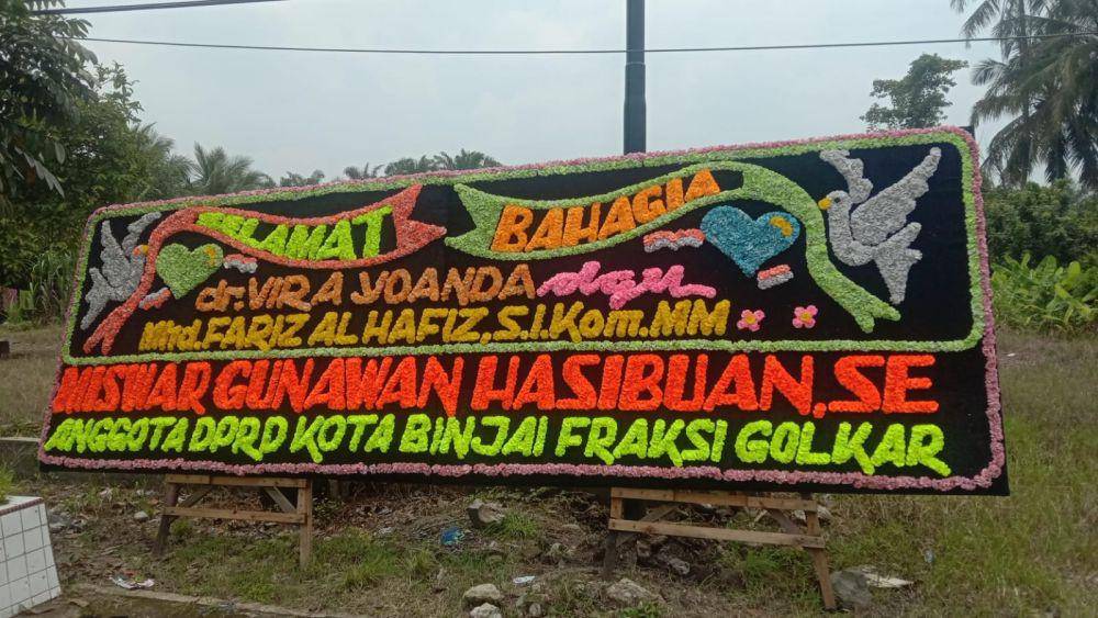 Papan bunga yang hilang dipernikahan anak walikota binjai (IDN Times/ istimewa)