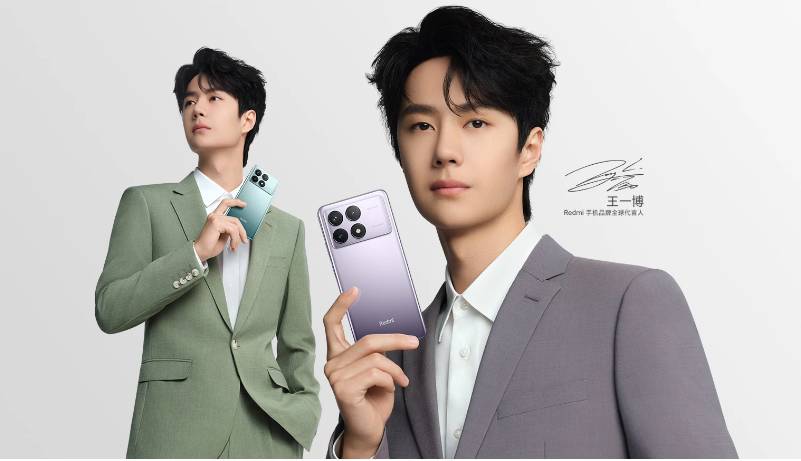 Dua orang memegang Redmi K70. )mi.com)