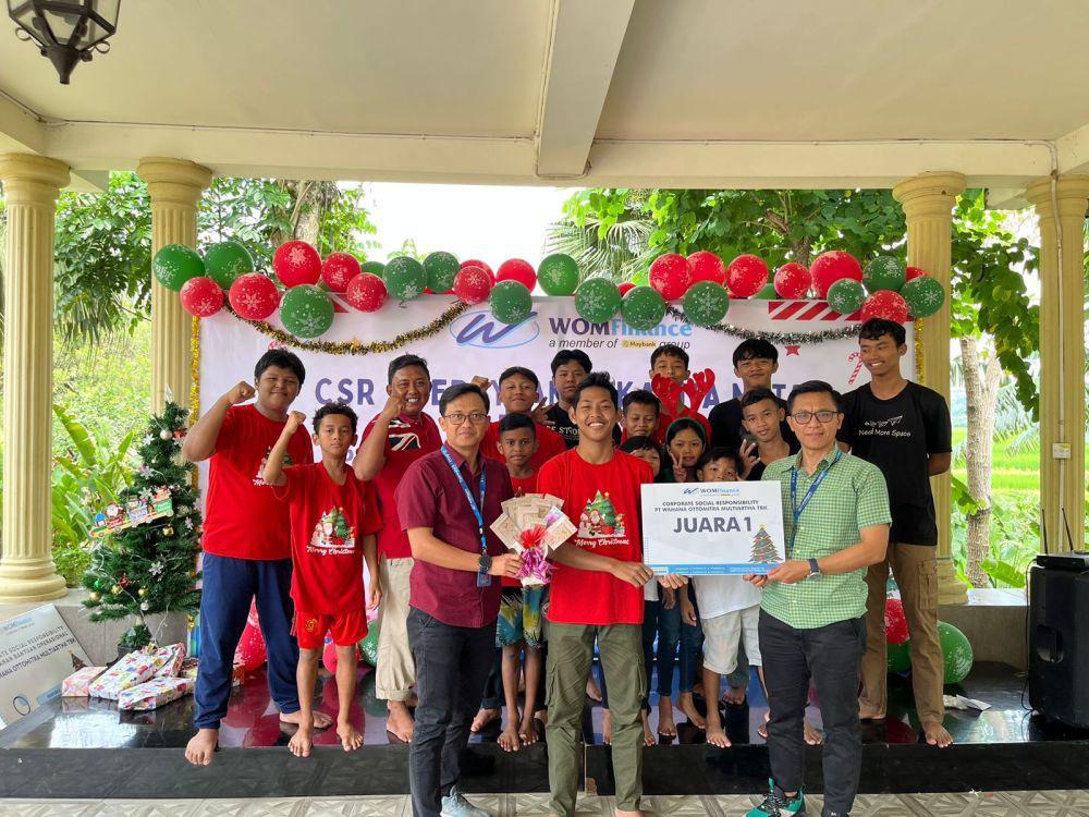WOM Finance menggelar kegiatan Corporate Social Responsibility (CSR) dengan mengusung tema “Cinta Kasih Yang Membumi” bersama anak-anak Panti Asuhan Griya Bahtera Kasih. (dok. WOM Finance)