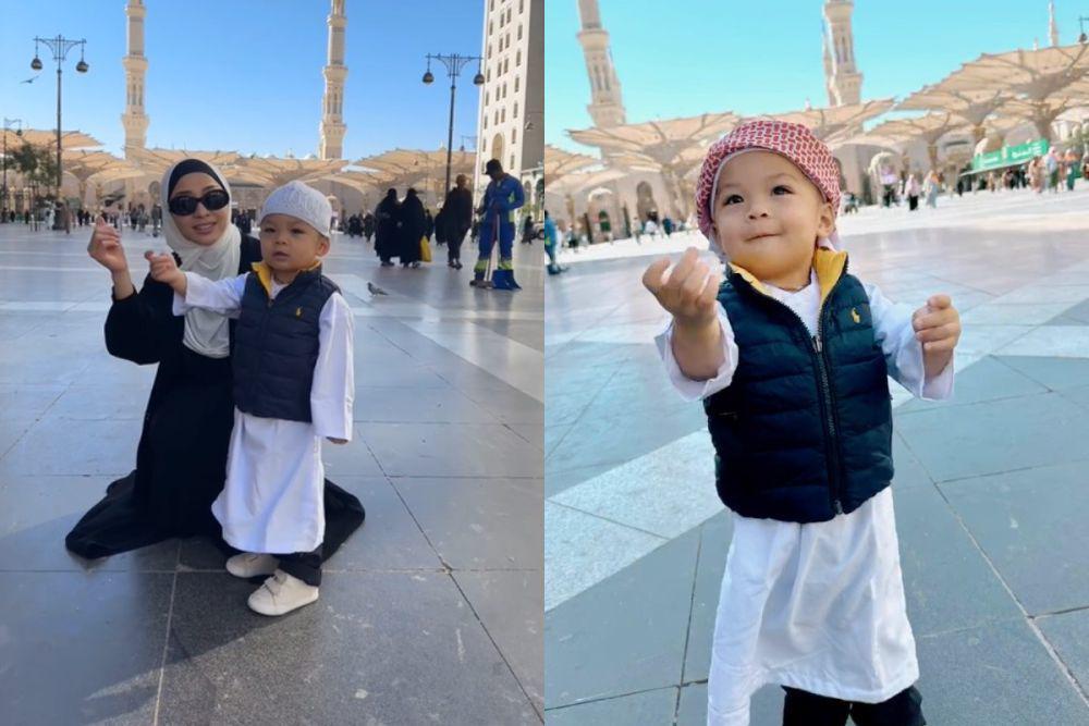 7 Potret Gemas Baby Issa di Tanah Suci, Pakai Gamis dan Peci Terus!