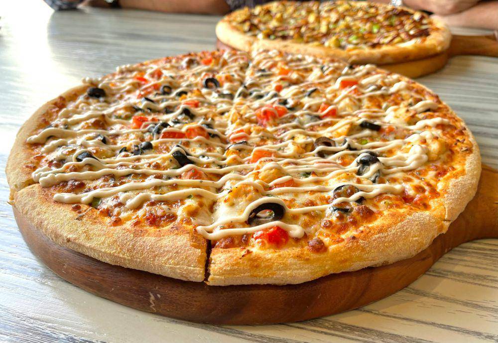 ilustrasi pizza topping kornet (unsplash.com/Faizan Saeed)