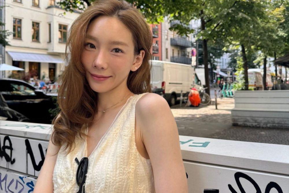 7 Potret Taeyeon SNSD Liburan di Jerman, Chill Banget!