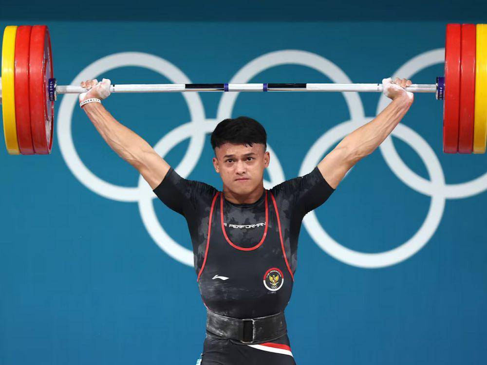 Rizki Juniansyah, atlet angkat besi Indonesia (olympics.com)
