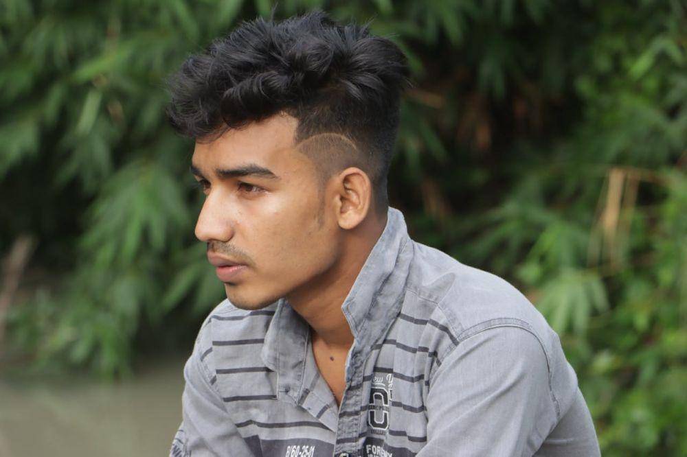 ilustrasi gaya rambut ikal pria mohawk (Pexels.com/Pŕįňčě Hâśîbûĺ Îşľãm)