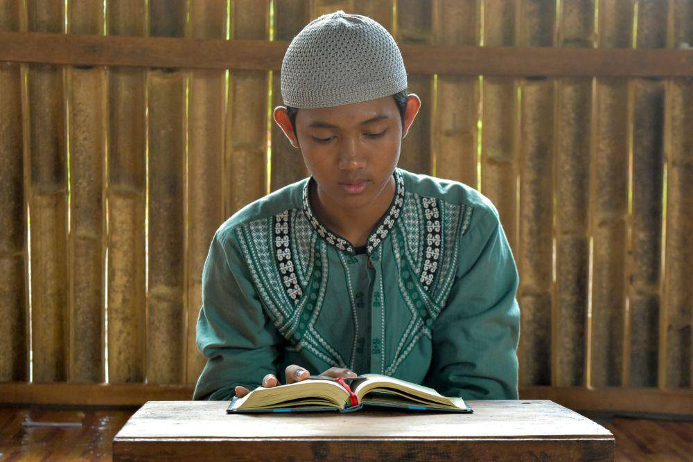 ilustrasi penghafal Al-Qur'an (unsplash.com/herhy Ad)