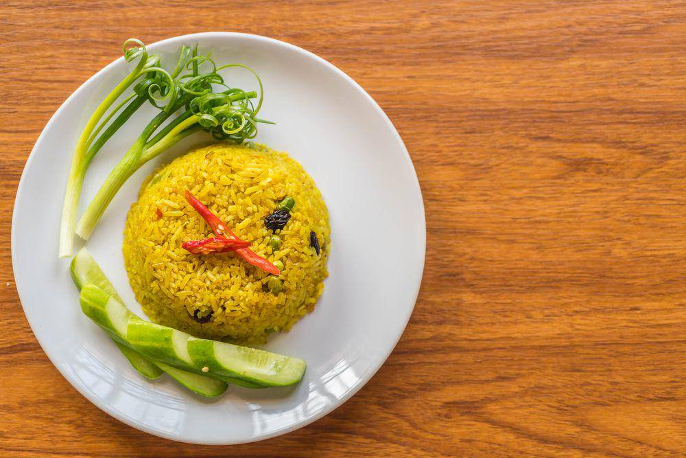 Ilustrasi nasi kuning. Foto: Freepik/topntp26