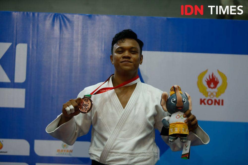 Pejudo Sumut Willi Pratama meraih perunggu di kelas 70 kg PON 2024 (IDN Times/Doni Hermawan)
