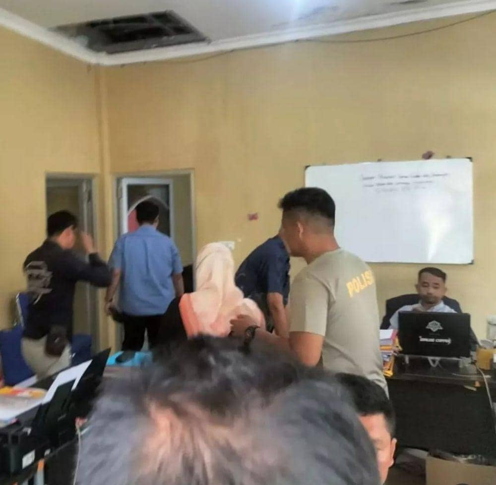 Suami salah satu oknum guru yang diduga berselingkuh saat membuat laporan ke polisi. (IDN Times/istimewa)