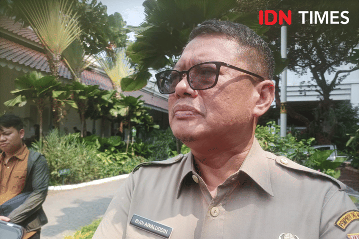 Kepala Dinas Kependudukan dan Pencatatan Sipil Provinsi DKI Jakarta, Budi Awaluddin di Balai Kota, Rabu (25/9/2024). (IDN Times/Dini Suciatiningrum)