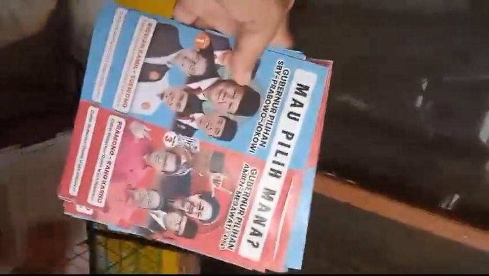 Tangkap layar video diduga Timses RIDO pasang stiker perbandingan dukungan yang didapat Ridwan Kamil dan Pramono (X.com/@GunRomli)