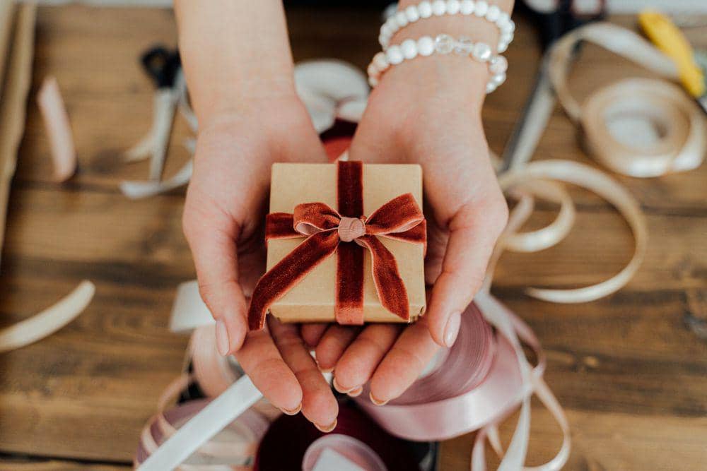 Person Holding a Small Gift Box (pexels.com/Antoni Shkraba)