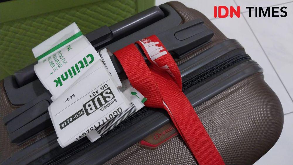 Kenapa Tidak Boleh Menandai Koper dengan Pita?