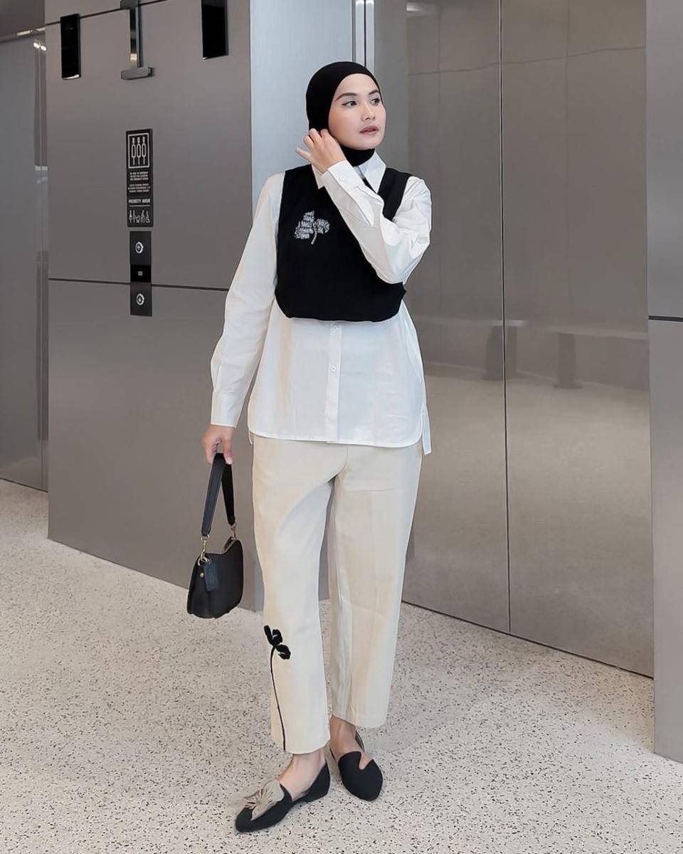 mix and match vest hitam ala Anggita Kusuma Dewi (instagram.com/kusumanggi)