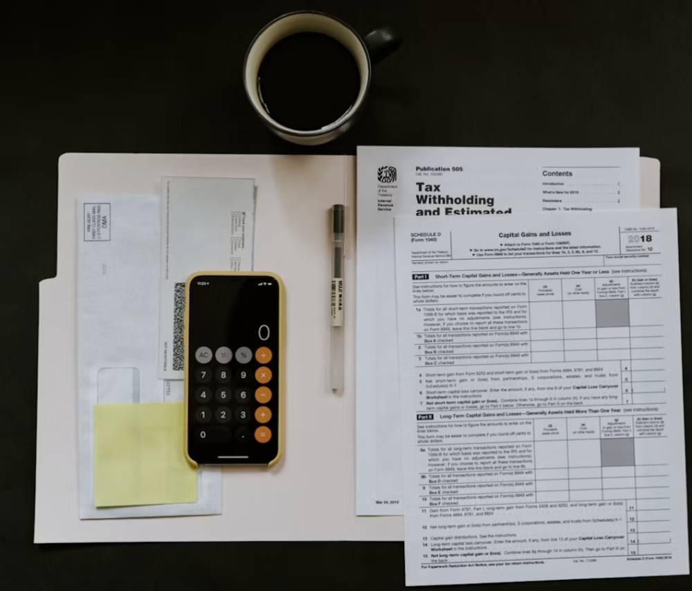 Tax (https://unsplash.com/photos/black-android-smartphone-near-ballpoint-pen-tax-withholding-certificate-on-top-of-white-folder-M98NRBuzbpc)