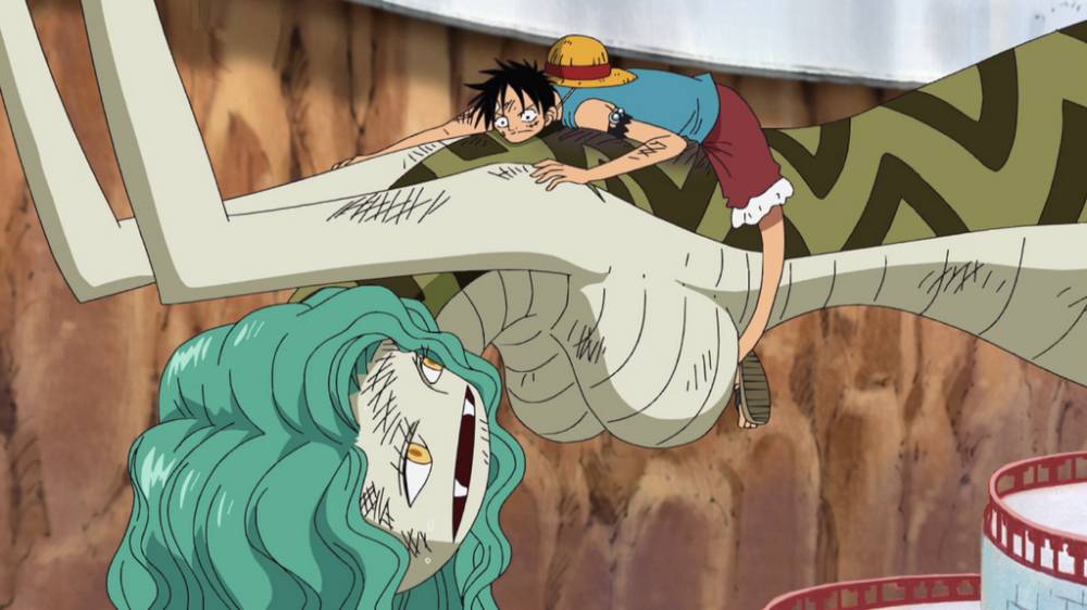 Luffy menutupi tanda budak Sandersonia. (dok. Toei Animation/One Piece)
