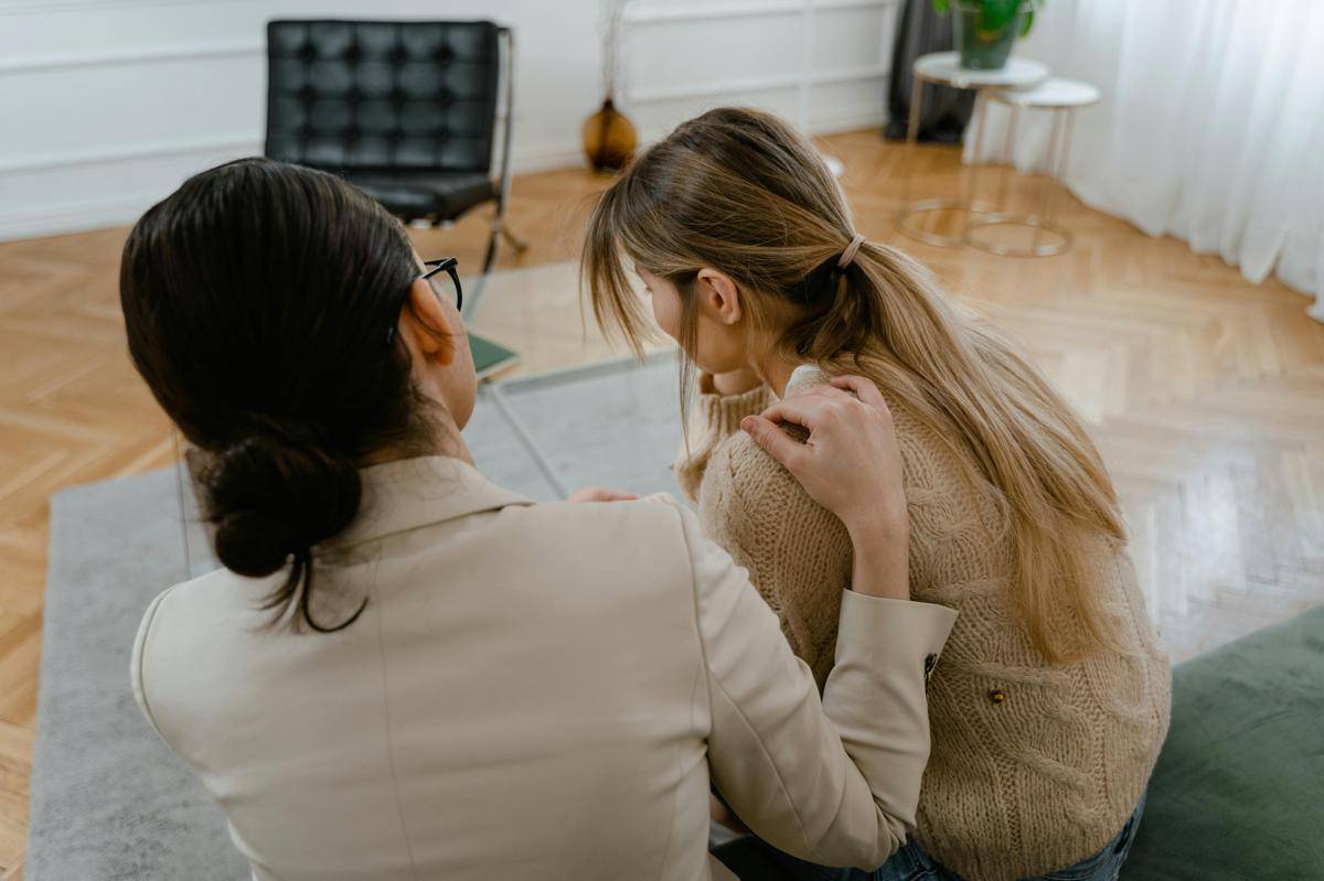 Photo by MART PRODUCTION: https://www.pexels.com/photo/back-view-of-person-comforting-her-friend-7699502/