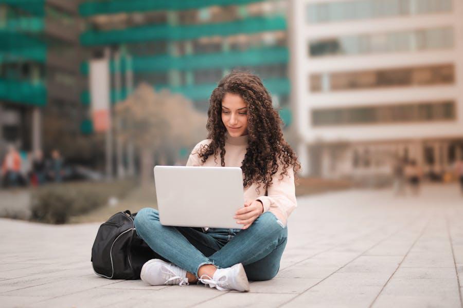 https://www.pexels.com/photo/woman-in-pink-sweater-using-laptop-3764402/