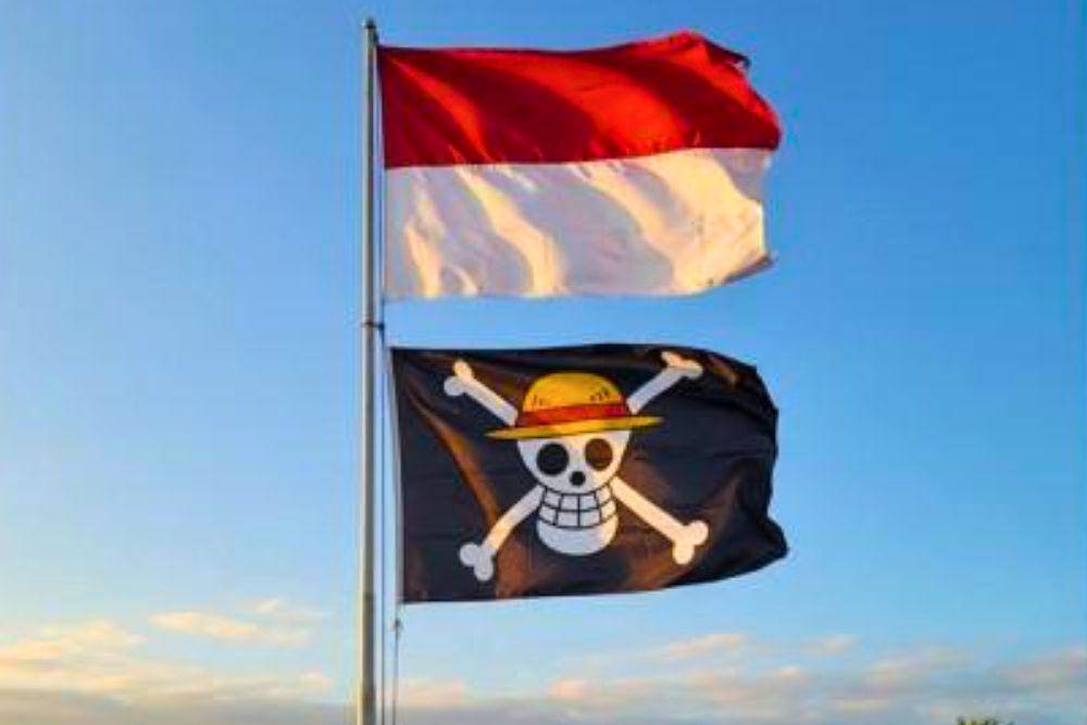 Ilustrasi bendera One Piece yang berkibar di bawah bendera Merah Putih. (Situs jateng.tribunnews.com)