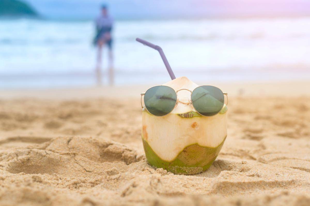 vecteezy_fresh-coconut-with-drinking-straw-on-the-beach-travel-and_8741036.jpg