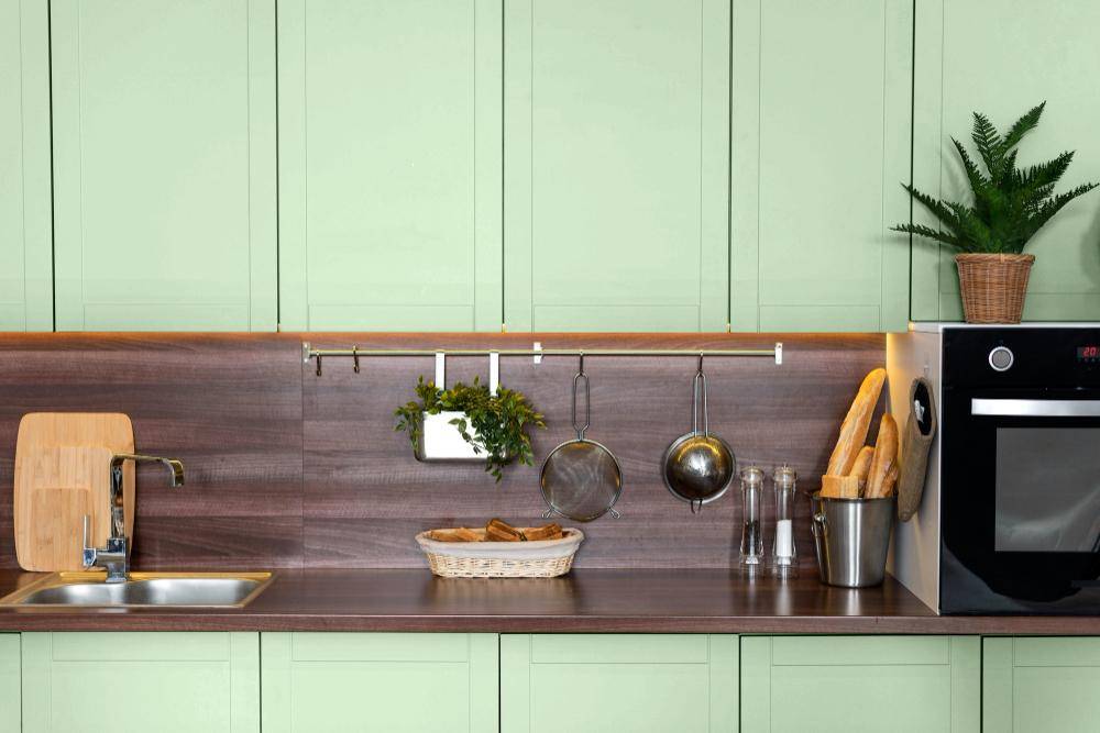 ilustrasi kabinet dapur berwarna hijau sage