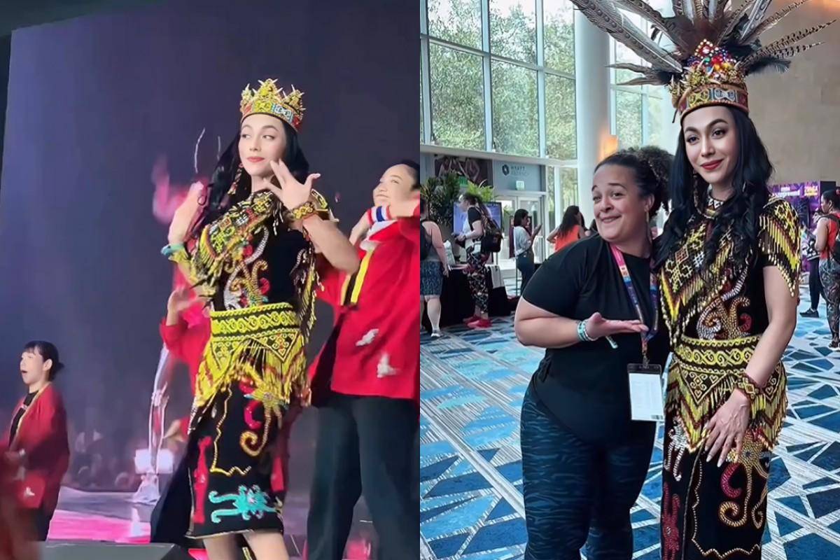Denada pakai baju adat Kalimantan pada acara Zumba internasional.