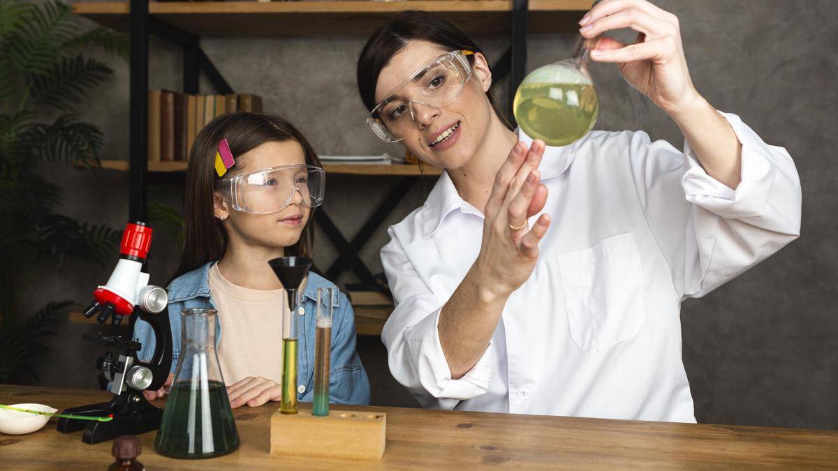 girl-teacher-doing-science-experiments-with-microscope.jpg